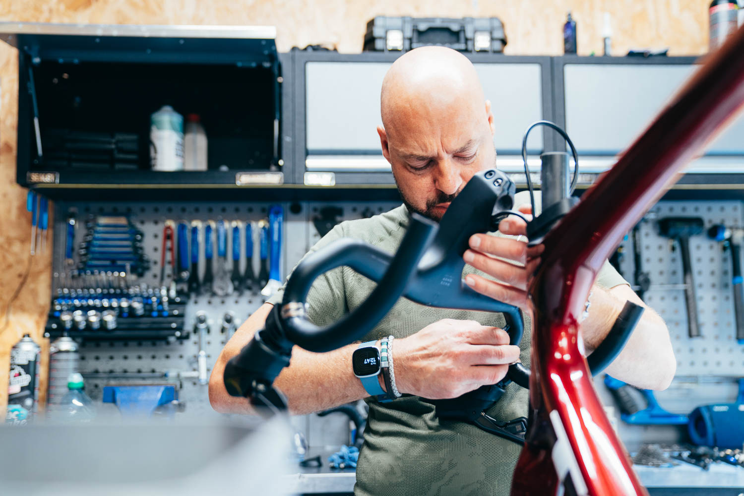 The Velo Works — Mike Cook working on a road bike in the workshop